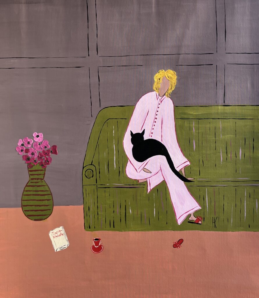 woman with black cat at home